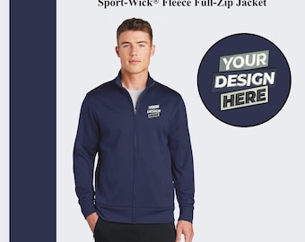 May include: A navy blue fleece full-zip jacket with a zipper closure. The jacket has a mock neck and two front pockets. The jacket has a small embroidered patch on the left chest that says "YOUR DESIGN HERE".