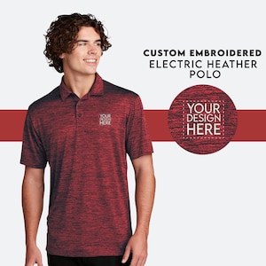 May include: A red and black heather polo shirt with a short sleeve and a button-down collar. The shirt has a small embroidered logo on the left chest that says "YOUR DESIGN HERE".