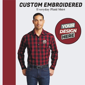 May include: A red and black plaid long-sleeve shirt with a button-down collar. The shirt has a small embroidered patch on the left chest that says "YOUR DESIGN HERE".