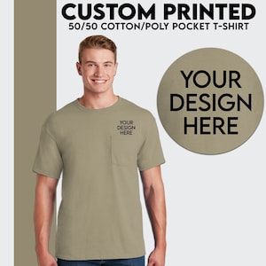 May include: A khaki t-shirt with a pocket on the left side. The t-shirt is made of a 50/50 cotton/poly blend. The text "YOUR DESIGN HERE" is printed on the pocket and on a circle in the upper right corner of the image.