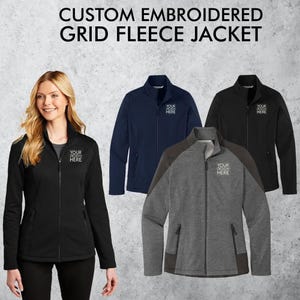 May include: Three fleece jackets in black, navy blue, and gray with a grid pattern. Each jacket has a zipper closure and two pockets. The jackets are embroidered with the text "YOUR DESIGN HERE".
