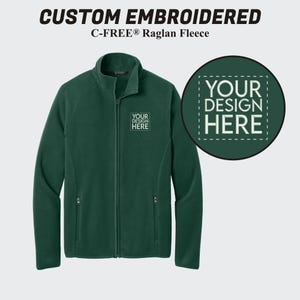 May include: A dark green fleece jacket with a zipper closure and two pockets. The jacket has a C-FREE® Raglan Fleece label and a space for a custom embroidered design with the text "YOUR DESIGN HERE".