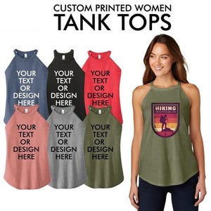 May include: Five tank tops in different colors with the text "Your text or design here" printed on the front. One tank top is olive green with a graphic of a hiker and the text "Hiking Editable".