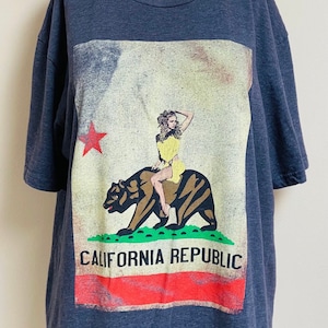 90s California Republic Large Front Graphic Blonde Woman On Bear Navy Blue Broken In Vintage Tshirt Large Roomy Soft & Relaxed