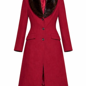 May include: A long, red coat featuring a faux fur collar. The coat has a tailored fit, button closure, and front pockets. The collar is a dark brown colour, and the coat is a solid, vibrant red.