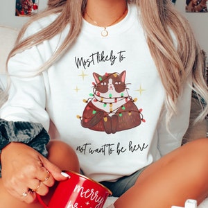 Most likely to Christmas sweater, Christmas cat sweater for women, Ugly Christmas sweater funny, Funny cat Christmas shirt, Xmas Crewneck