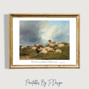 Op de afbeelding: Een ingelijste print van een schilderij dat een kudde schapen in een veld toont. De lucht is bewolkt en de schapen zijn bij elkaar. De print bevat de tekst "The Lord is my shepherd, I shall not want. Psalm 23:1."