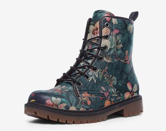 May include: Combat boots with a floral pattern in shades of teal, pink, and cream. The boots have black laces, a brown sole, and a small heel. The design features a botanical print of flowers and foliage.