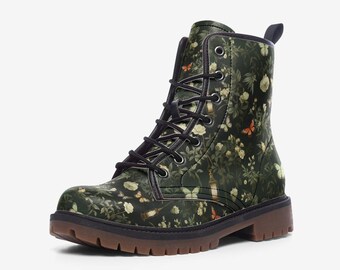 May include: A combat boot with a dark green floral pattern featuring white flowers and orange butterflies. The boot has black laces, a brown sole, and a pull tab at the back. The boot is approximately 8 inches tall.