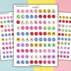 May include: Three sheets of stickers labeled Color Bead Letters featuring rows of circular icons in various colors, each displaying a single black uppercase letter from A to Z. The sheets include the text Happy Plan Girls and the website address.