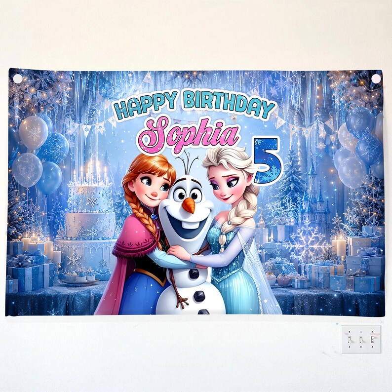 May include: A birthday banner featuring characters from the movie Frozen, with the text "Happy Birthday Sophia 5". The banner has a blue and white color scheme with images of a birthday cake, balloons, and snowflakes.
