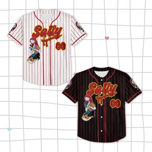 May include: Two short-sleeve button-down baseball jerseys, one white with red pinstripes and one black with red pinstripes. Both feature the name Sally in red script, the number 00 in yellow, and a graphic of the character Sally on the front.