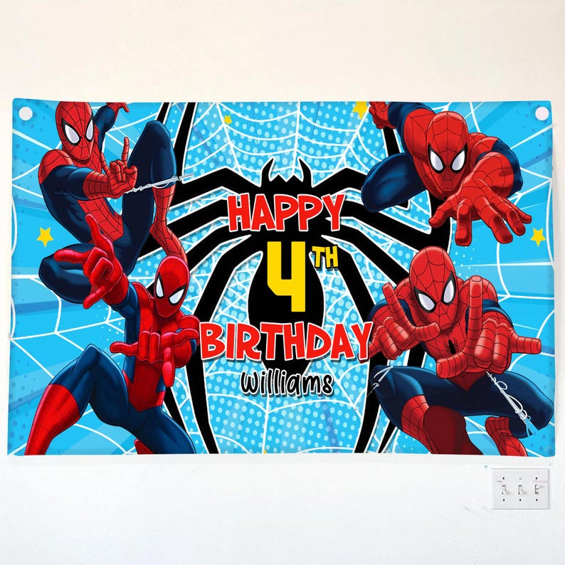 May include: A blue banner featuring Spider-Man illustrations and the text "HAPPY 4TH BIRTHDAY Williams". The banner has a light blue background with a spiderweb pattern and yellow stars.