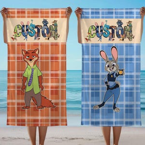 May include: Two custom beach towels, one orange and one blue, each with a plaid pattern. The orange towel features Nick Wilde, and the blue towel features Judy Hopps, both from Zootopia. The word "CUSTOM" is across the top.