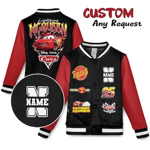 May include: Black and red varsity jacket featuring Lightning McQueen from Disney Pixar's Cars. The jacket has a white collar and cuffs, with patches and the text "NAME" and "95". The back displays "Lightning McQueen" and "Cars".