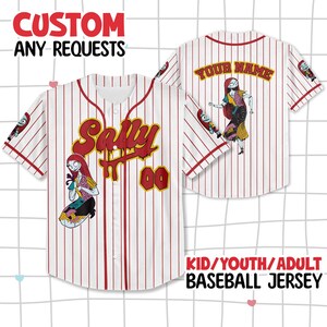 May include: A white baseball jersey with red pinstripes featuring the character Sally from The Nightmare Before Christmas. The front displays the name Sally and the number 00 in red and yellow. The back includes a custom name field.
