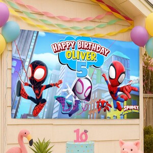 May include: A rectangular birthday banner featuring the text Happy Birthday Oliver 5 with cartoon characters from Spidey and His Amazing Friends, including a black and red spider character, a white and purple spider character, and a red spider character.