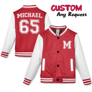May include: Red and white letterman jackets with the text "MICHAEL" and the number "65" on the back. One jacket has the letter "M" on the front. The jackets have white sleeves and striped cuffs and hem. The text "CUSTOM Any Request" is in the upper right corner.