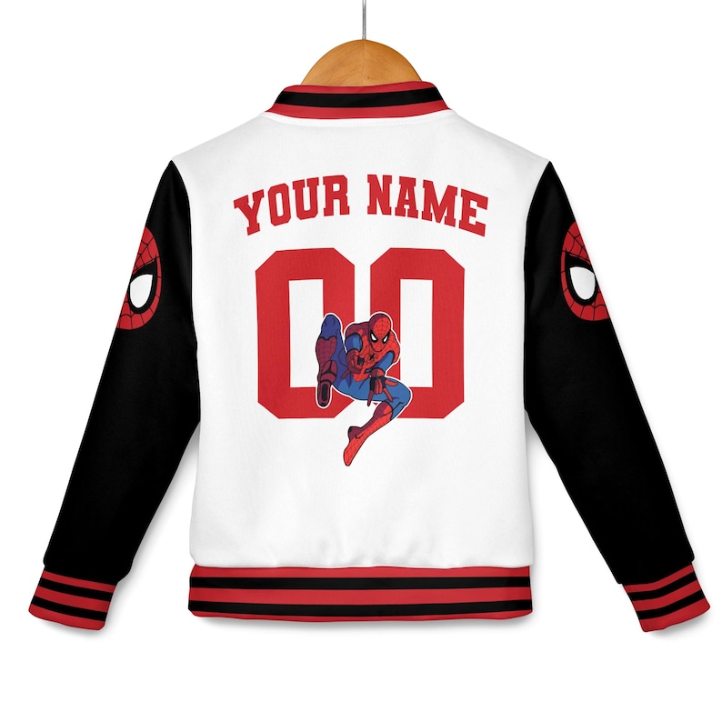 May include: White and black letterman jacket with red accents. The back features the text "YOUR NAME" above the number "00" and a Spider-Man graphic. The sleeves have a Spider-Man logo.