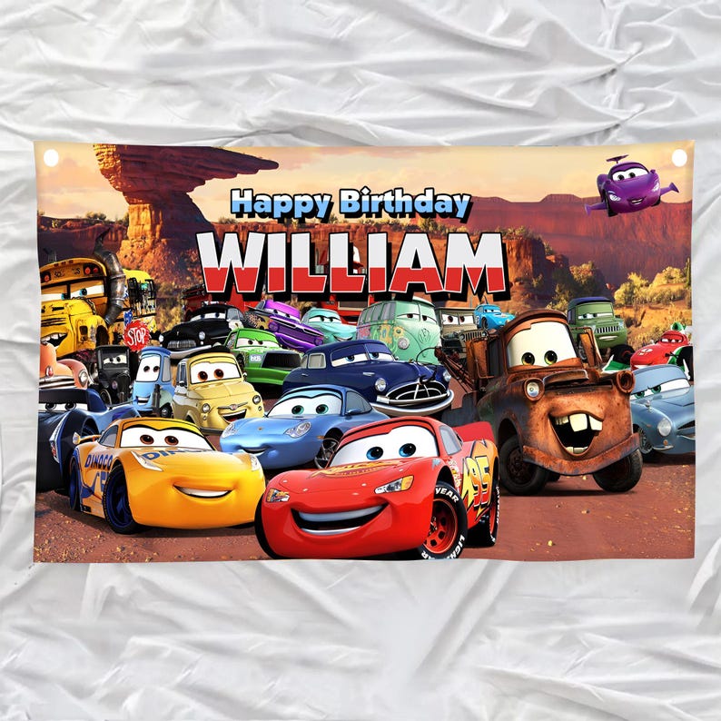 May include: A banner featuring characters from the animated movie Cars, with the text "Happy Birthday WILLIAM" in large, bold letters. The background depicts a desert landscape with red rock formations and a blue sky.