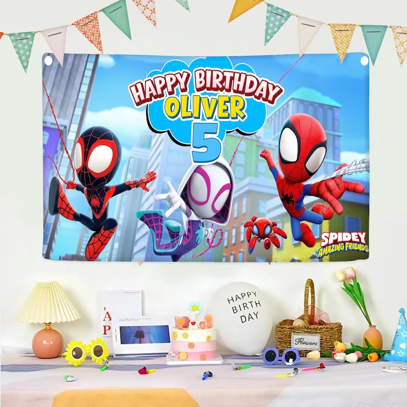 May include: A rectangular birthday banner featuring Spidey and His Amazing Friends characters, the text "HAPPY BIRTHDAY OLIVER 5", and a city background. The banner is decorated with colorful triangular bunting flags along the top edge.