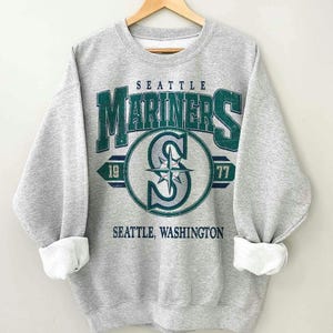 Camiseta vintage de gola redonda do Seattle Mariners Baseball, moletom unissex para o dia do jogo, presente perfeito para fãs de beisebol.