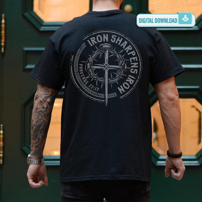 May include: Black t-shirt with a circular graphic on the back. The graphic features a cross, a crown of thorns, and the text "IRON SHARPENS IRON" and "PROVERBS 27:17". The shirt is a digital download.