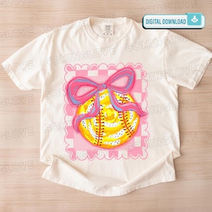 May include: Off-white t-shirt with a softball graphic. The softball is yellow with red stitching and a pink and blue bow. The design is set on a pink and white checkered background. The words "DIGITAL DOWNLOAD" are in the upper right corner.