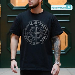 May include: Black t-shirt with a circular graphic featuring the text "IRON SHARPENS IRON" and "PROVERBS 27:17". The design includes a cross and a crown of thorns. The words "DIGITAL DOWNLOAD" are in a white rectangle in the upper right corner.