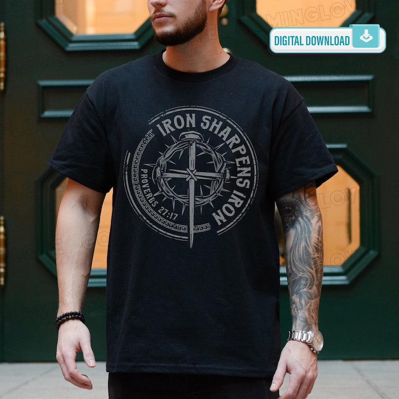 May include: Black t-shirt with a circular graphic featuring the text "IRON SHARPENS IRON" and "PROVERBS 27:17". The design includes a cross and a crown of thorns. The words "DIGITAL DOWNLOAD" are in a white rectangle in the upper right corner.