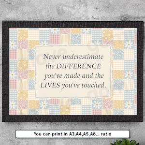 May include: A framed wall art print featuring a patchwork quilt pattern in pastel yellow, blue, and pink with white daisy motifs. The center contains the text: Never underestimate the DIFFERENCE you've made and the LIVES you've touched.