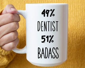 May include: White ceramic mug with black text that reads "49% Dentist 51% Badass".