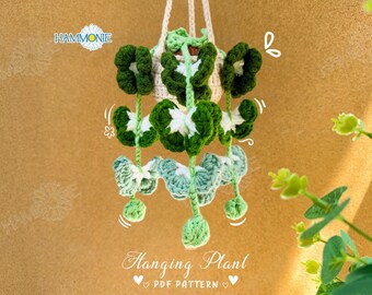 May include: A crochet hanging plant pattern with green and white leaves. The pattern is called "Hanging Plant" and includes a PDF pattern.