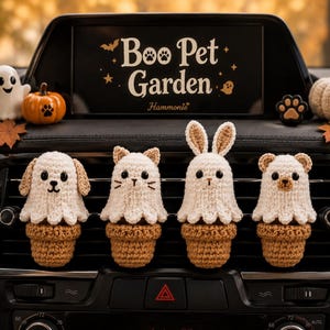 May include: Four crocheted animal figures in ghost costumes, each sitting in a small brown pot, attached to a car air vent. The figures resemble a dog, cat, rabbit, and bear. A screen above displays the text Boo Pet Garden with a bat and ghost icon.