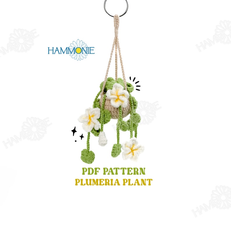 May include: A crochet pattern for a hanging plumeria plant. The pattern includes instructions for crocheting the plant, pot, and hanging loop. The pattern is available as a PDF download.