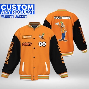 May include: An orange and black varsity jacket featuring Goofy graphics, the text "YOUR NAME", "GOOFY", "00", "Disneyland", and "EST 1928". The jacket has a snap-button front, striped ribbed collar, cuffs, and hem, and displays both front and back views.