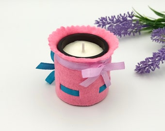 Pink turquoise ribbon bow candle - cozy interior design accent with felt decoration (ornament) - striking eye-catcher candle for living room