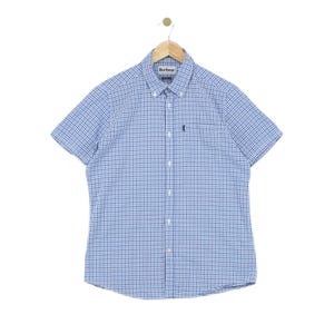 May include: A short-sleeved button-down shirt featuring a blue and white gingham check pattern. The shirt includes a button-down collar, a front button placket, and a small embroidered logo on the left chest pocket. The label reads Barbour.