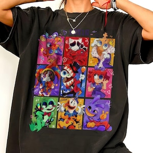 May include: A black short-sleeve t-shirt featuring a grid of nine colorful cartoon character illustrations. The graphic includes various figures with expressive faces, including a clown, a frog, and a jester, with the text "ERROR" and "NO EXIT" visible.