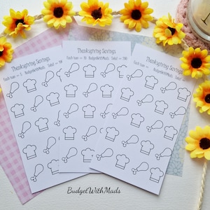 May include: Four sheets of white paper with black outlines of turkey legs and chef hats. The sheets are labeled "Thanksgiving Savings" and have the text "Each token = 5 BudgetWithMads Meals Total = 100" on one sheet and "Each token = 10 BudgetWithMads Meals Total = 200" on another sheet.