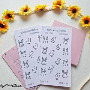 May include: Two white Easter Savings Challenge cards with bunny and chick illustrations. The cards are surrounded by yellow sunflowers and a pink envelope. The text "Easter Savings Challenge" and "BudgetWithMads" are visible.