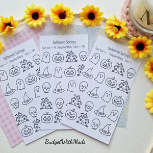 May include: Three sheets of Halloween themed stickers with various designs including ghosts, pumpkins, witches hats, skulls, and haunted houses. Each sheet has the text "Halloween Savings" and "BudgetWithMads" printed on it.