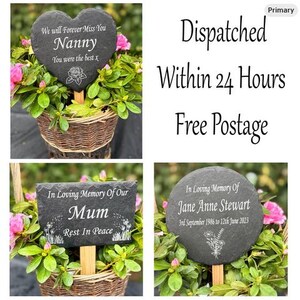 May include: Slate memorial garden stakes in heart, rectangular, and round shapes. The heart-shaped stake reads "We will Forever Miss You Nanny." The rectangular stake says "In Loving Memory Of Our Mum." The round stake says "In Loving Memory Of Jane Anne Stewart."