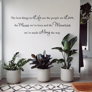 May include: A white ceramic mug with a black handle and the text "But First, Coffee" in a handwritten style. The mug is on a white surface. The mug is 4 inches tall.