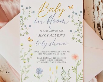 May include: A baby shower invitation with a floral design. The invitation says "Baby in Bloom" and includes the name "Macy Allen's" and the date and time of the shower.