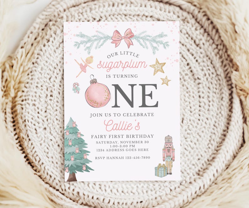 May include: A rectangular birthday invitation card featuring a pink bow, a ballerina, gold stars, a pink ornament, a Christmas tree, and a nutcracker. The text reads: Our little sugarplum is turning one, join us to celebrate Callie's fairy first birthday.