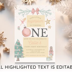 May include: A rectangular birthday invitation card featuring a pink ornament, a green Christmas tree, a nutcracker, and a ballerina illustration. The text reads: Our little sugarplum is turning one, join us to celebrate Callie's fairy first birthday.