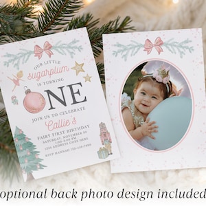 May include: A two-sided birthday invitation card featuring a pink and blue holiday theme. The front displays text reading Our Little Sugarplum Is Turning One, Callie's Fairy First Birthday, with illustrations of a nutcracker, tree, and ornament.