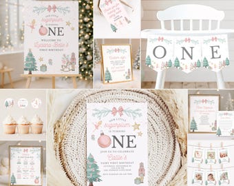 May include: A collection of party stationery and decorations featuring a Sugarplum theme with pink bows, Christmas trees, nutcrackers, and ballerinas. Items include birthday signs, a banner spelling ONE, cupcake toppers, and photo display cards.