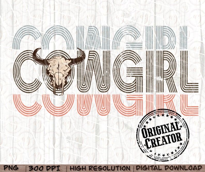 May include: Cowgirl graphic design with a cow skull in the center. The text is in a retro style with brown, pink, and blue stripes. The text reads "Cowgirl Cowgirl". A distressed black circle stamp reads "Original Creator".